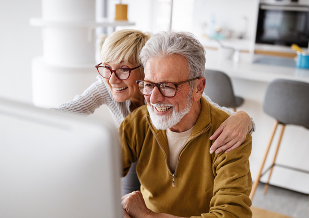 Couple looking on computer together