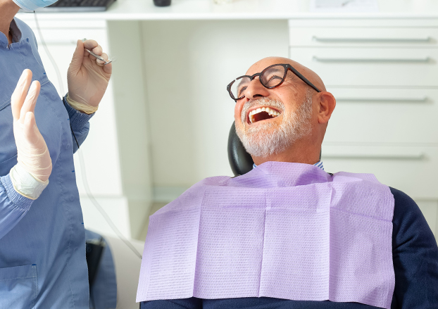 Man smiling at the dentist